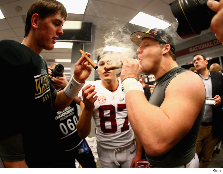 Alabama's Jake Coker Fires Up Victory Cigar In Locker Room